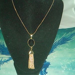 Gold and black  necklace and charm